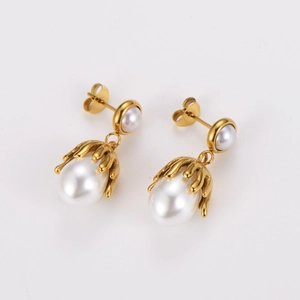 Octopus claw pearl earrings in gold finish with white teardrop pendants on white background