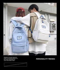 Blue and beige nylon backpacks shown in use outdoors with multi-layer zipper design