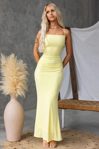 Detail of a light yellow bodycon maxi dress with spaghetti straps and slender fit