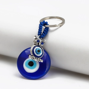 Blue Evil Eye owl keychain with silver metal pendant and blue tassel accessory
