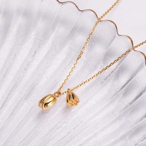 Gold-plated lotus pod and bud pendant necklace with dainty chain in minimalist design