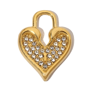 Macro shot of gold heart-shaped padlock pendant with shimmering crystal zircon pave setting