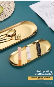 Detail showing high-gloss gold plated stainless steel oval trays in small and large sizes