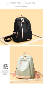 Detalle de la mochila de nailon oxford impermeable con cremalleras en contraste y rosa