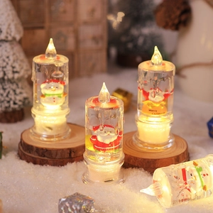 Close-up of LED glitter water candles with Santa and snowman inside for Christmas decor
