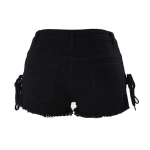 Detail view of black denim shorts featuring lace-up side ties and frayed raw hem edges