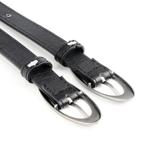 Punk style black leather belt with crescent rivets, star studs, and silver oval buckle