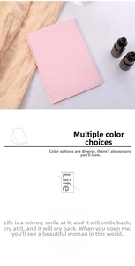 Slim pink folding makeup mirror in a minimalist rectangular design for portable use