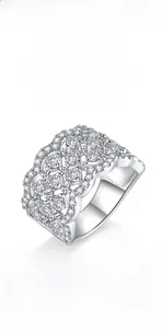 Macro shot of 925 sterling silver wide band ring featuring layered moissanite stones