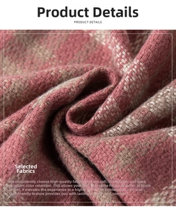 Detailed macro shot of soft rose pink and brown plaid fabric with thick twill texture