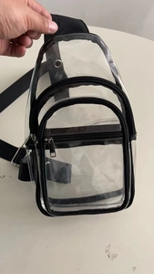 Detail of waterproof PVC sling bag showing black zippers and multi-layer structure