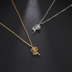 Detail of elegant rose flower pendant necklaces in gold and silver finishes