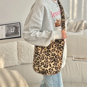 Detail showing the plush faux fur texture and leopard print pattern on this bucket bag