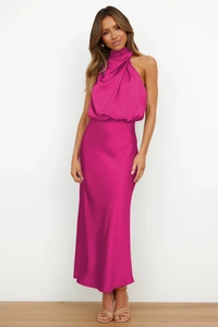 Detail of elegant magenta satin halter dress showing luxury fabric texture and drape