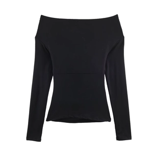 Detail view of the elegant black off-shoulder top featuring stylish double pleated neckline