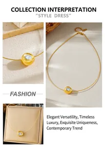 Detail of gold sycee pendant with round zircon on a minimalist stainless steel wire chain