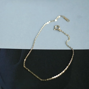 Detail of minimalist 14k gold plated 925 silver chain with spring clasp and metal tag