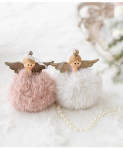 Macro detail of plush angel girl ornaments with golden wings and fluffy pompom texture