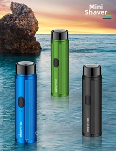 Mini portable electric shavers for men in blue green and black with non-slip texture