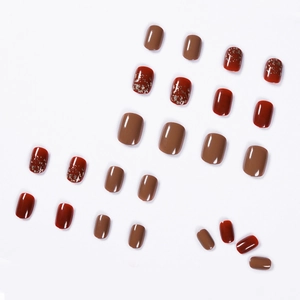 Short square burgundy and mocha brown press-on nails with gold glitter foil accents