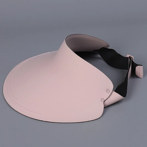 Detail view of pink wide-brim sun visor with adjustable black elastic strap
