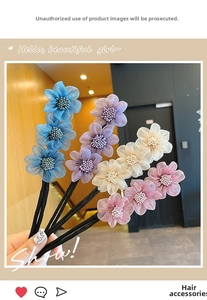 Detailed view of handmade multi-color floral hair ties featuring layered mesh petals