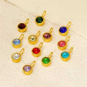 Polished stainless steel birthstone charms with colorful zircons in golden setting