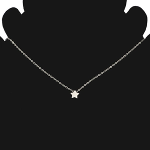 Detail of silver star pendant necklace shown on a black silhouette model stand