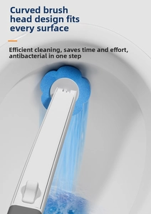Detail view of flower-shaped disposable toilet brush head cleaning a white ceramic bowl