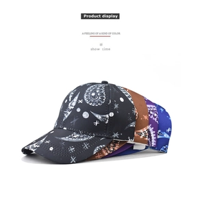 Close-up of paisley pattern printed baseball caps in black, brown, purple, and blue colors