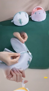 Detailed views of printed sandwich mesh laundry bag with zipper and hanging strap