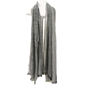 Men's grey plaid scarf with fringe edges displayed on a white mannequin torso