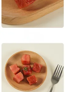 Macro view of realistic beef cube models and rosemary garnish on a wooden plate