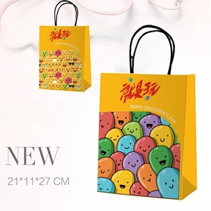 Close-up of Children's Day kraft paper gift bag with emoji patterns and black rope handle