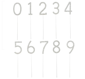 Detailed set of silver rhinestone cake toppers showing digits 0-9 on metal sticks