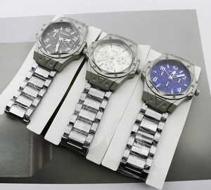 Detailed comparison of three-eye quartz watches in black, blue, and white steel dials
