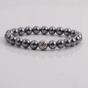 Macro shot of 8mm dark grey shell pearl bracelet with a silver textured metal bead