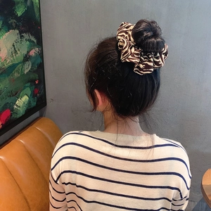 Zebra print cotton linen scrunchie shown from a rear view worn on hair