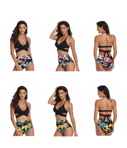 Detail view of high-waist bikini set with tropical leaf prints and halter wrap top