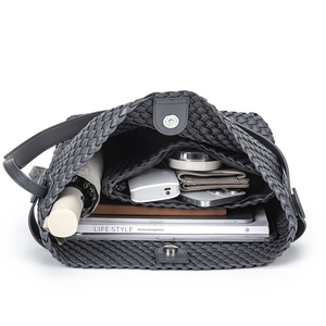 Handwoven dark grey PU leather tote bag with a spacious interior and magnetic closure