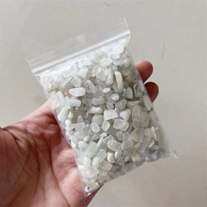 Macro detail of natural translucent white crystal gravel stones in a transparent bag