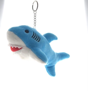 Detail of a mini shark plush keychain with blue and white fabric and a metal ring