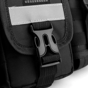 Detail view of the durable buckle and reflective strip on a tactical chest rig bag