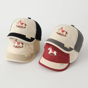 Detailed embroidery of a rocking horse on multi-color cotton baseball caps for children