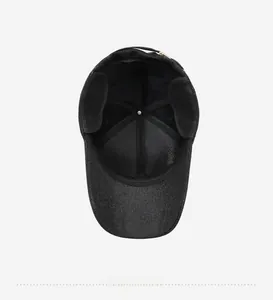 Detail view of the plush lining and ear protection inside the black baseball cap