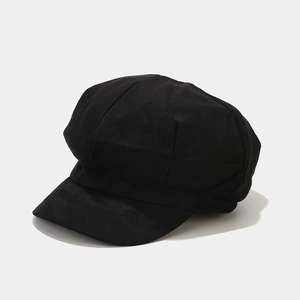 Side view of black faux suede newsboy cap featuring multi-panel design and curved brim