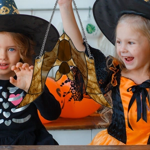 Halloween bat hanging decoration with amber resin texture on a silver metal chain