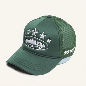Detail view of deep green trucker hat featuring five-star white embroidery and mesh panel