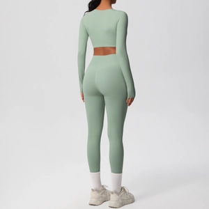 Rear view of Sage Green yoga set featuring long sleeve crop top and high waist leggings