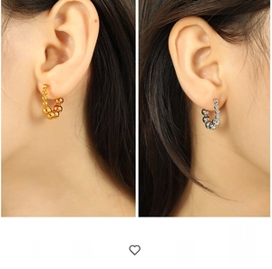 Detailed comparison of gold and silver beaded C-shaped earrings on model with high gloss
